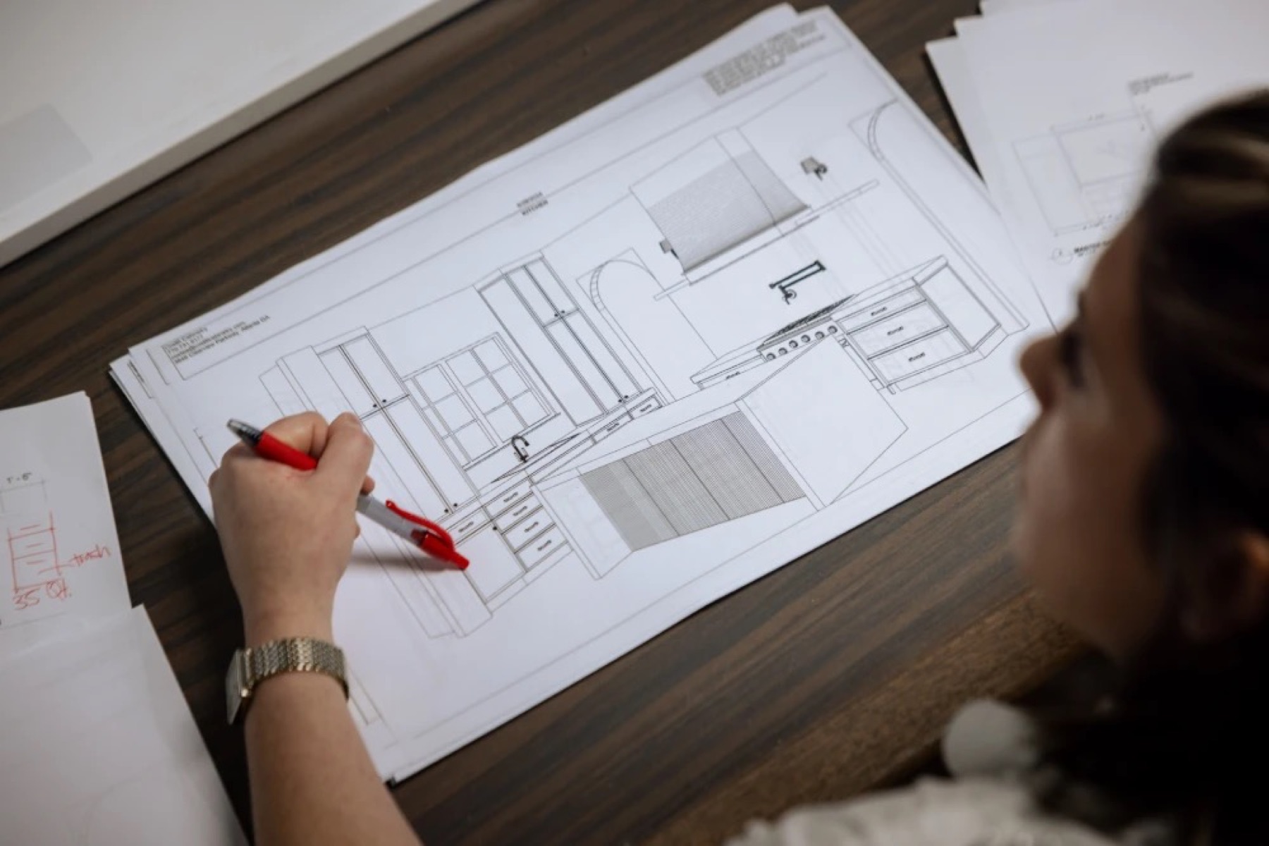 An architect drafting a floor plan by hand