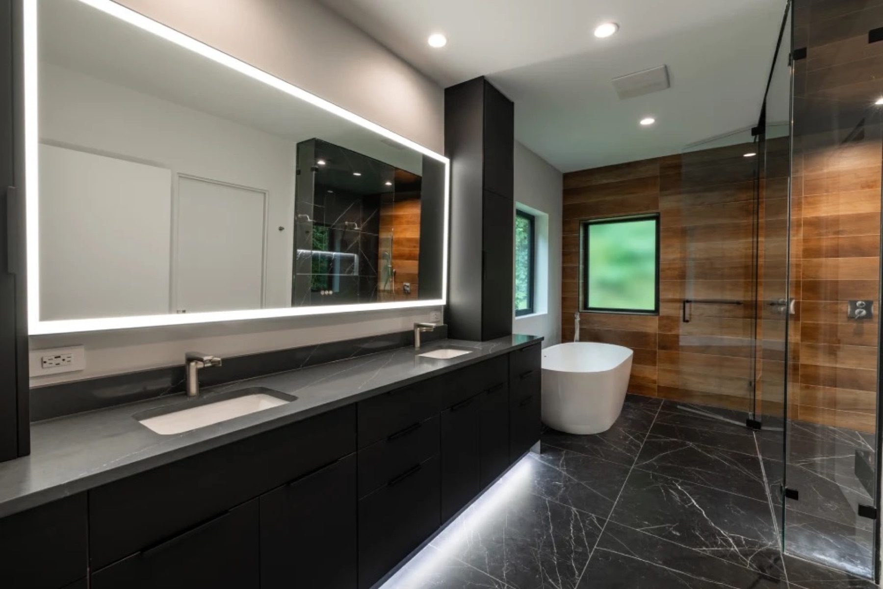 Primary bath with wood wall and freestanding tub