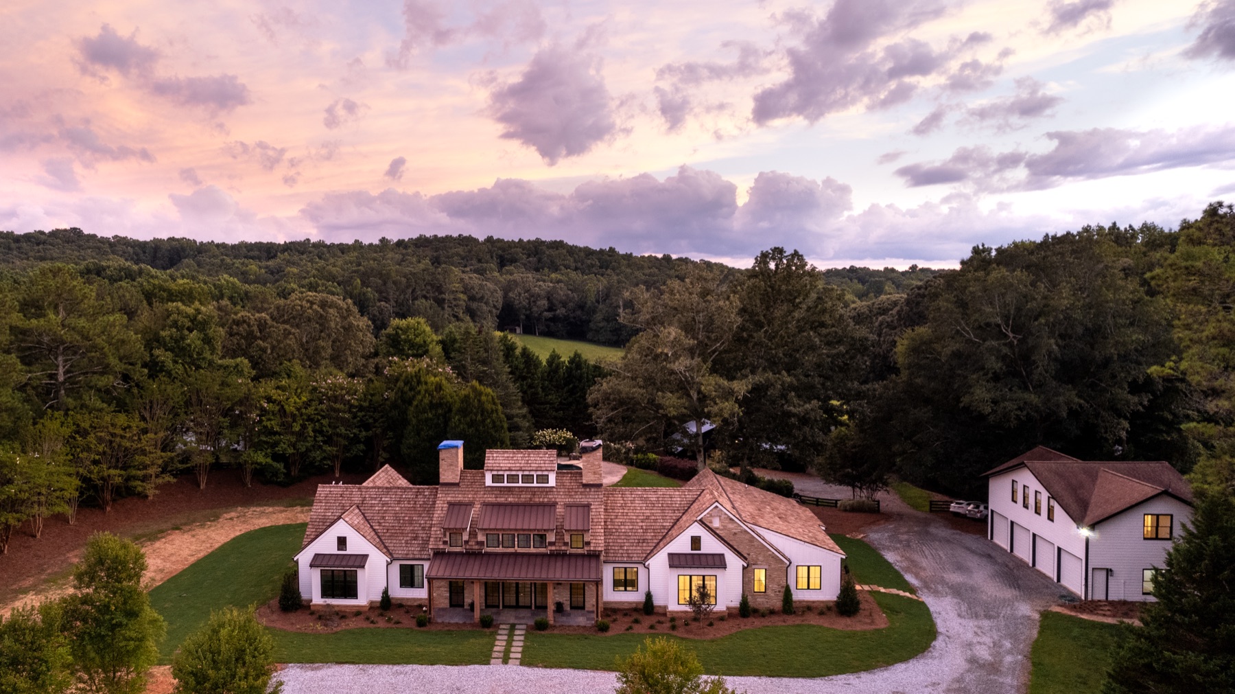 Aerial view of the estate and grounds at sunset